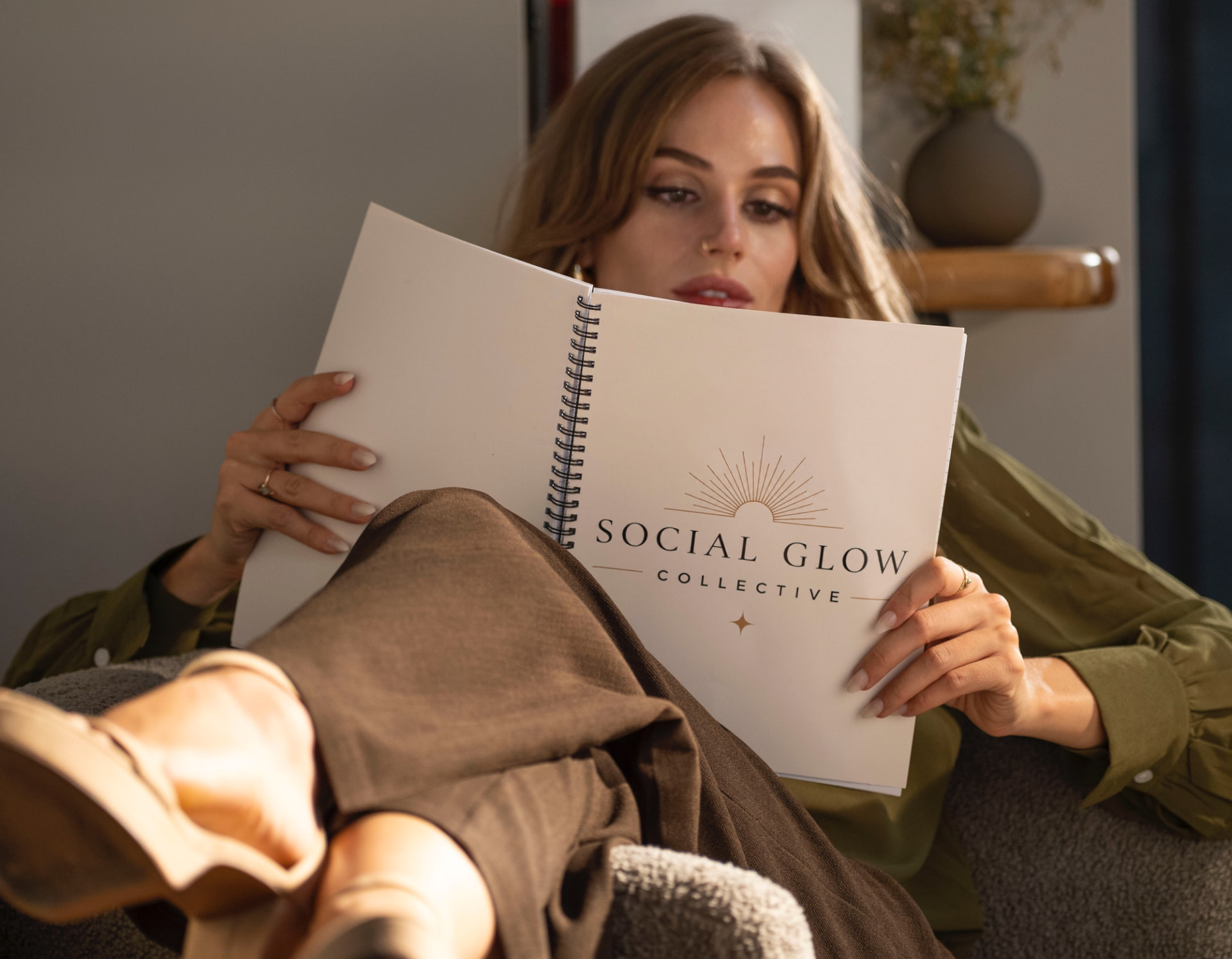 Mary Claire Materna with a Social Glow Collective strategy notebook